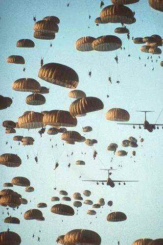 The sky full of armed-to-the-teeth Paratroopers ready to take the fight to the enemy and defeat him.  Paratroopers are trained to take the initiative and think, not sit and wait for someone to tell them what to do, like simplistic marines